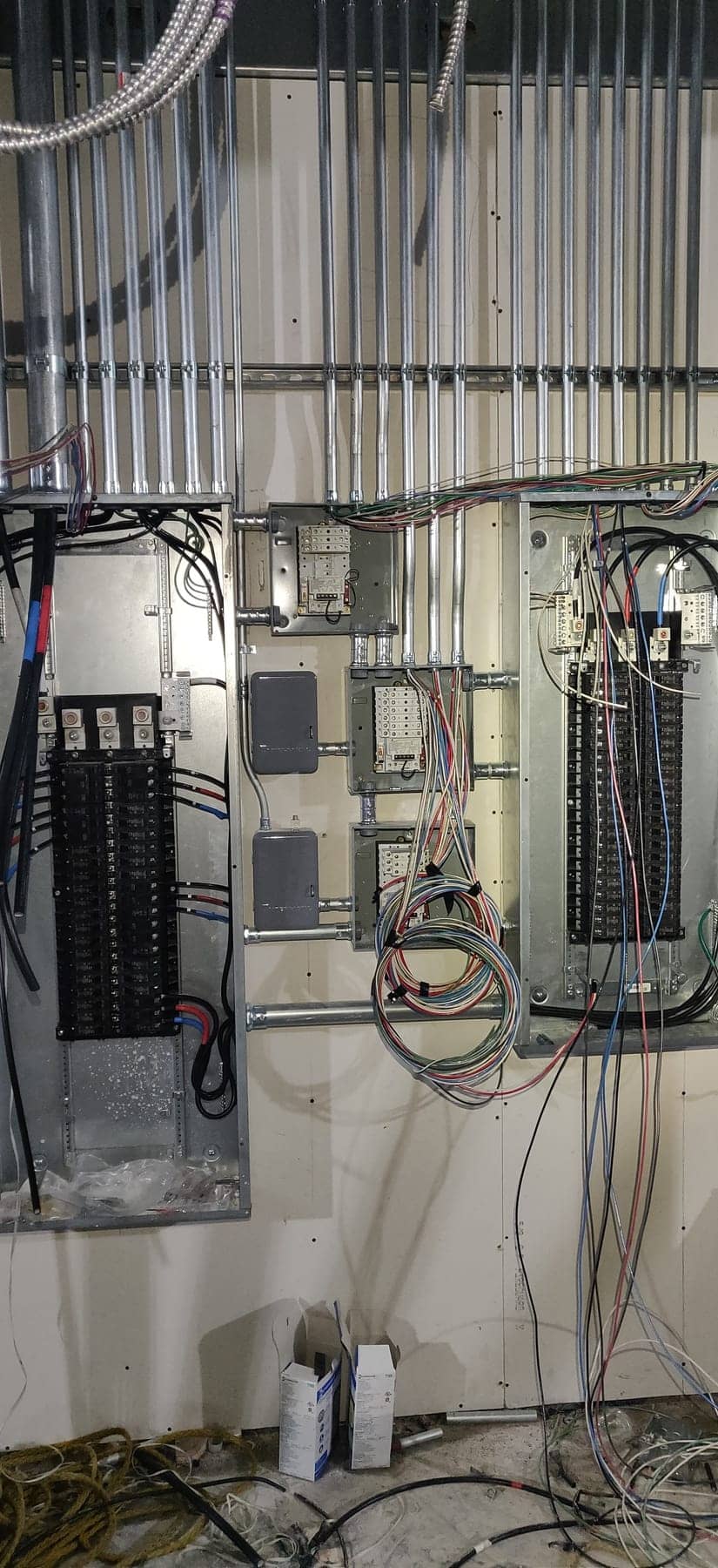 Electrical panel installation with EMT conduit feeders